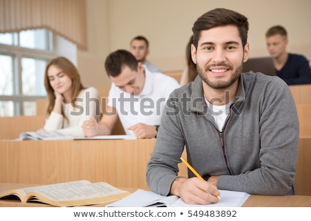 Foto d'archivio: Happy Student In His Classroom