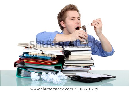 Foto stock: Overwhelmed Worker Eating From A Tin