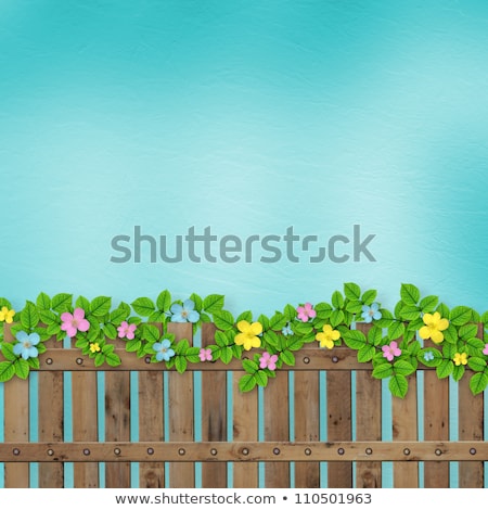 Сток-фото: Wooden Fence With A Flower Garland On The Abstract Background Of