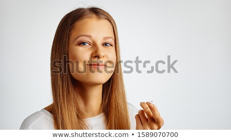 Foto stock: Happy Woman Holding Fingers Over Her Eye
