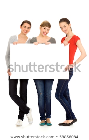 Stok fotoğraf: Teen Girl Holding A Sign With Copyspace For Adverts