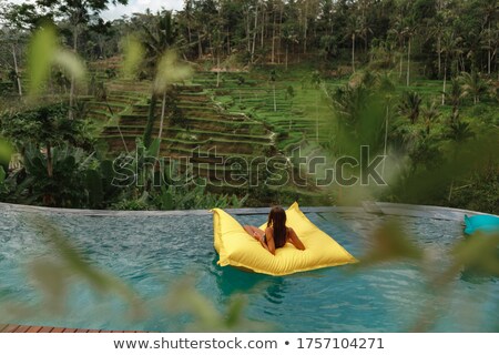 Stok fotoğraf: Back View Of Pretty Young Girls Having Fun At Pool