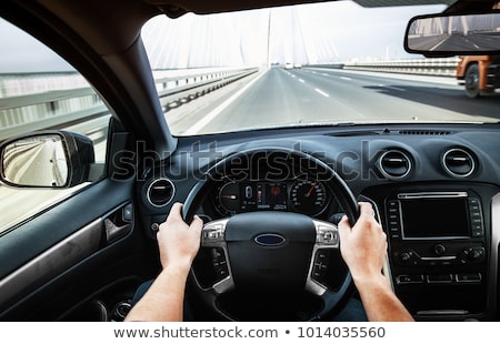 Foto stock: Female Hand On Car Steering Wheel