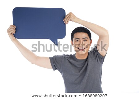 Сток-фото: Joyful Businessman Standing And Holding Up White Speech Bubble