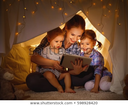 Stockfoto: Family With Tablet Pc In Kids Tent At Home