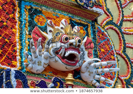 Foto d'archivio: Bade Cremation Tower With Traditional Balinese Sculptures Of Demons And Flowers On Central Street In