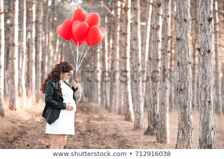 Foto stock: Woman 30 35 Years Old In A Stylish Red Dress In Pregnancy