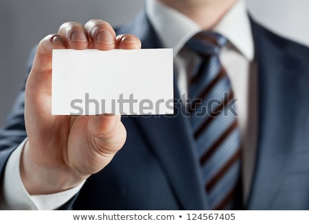 [[stock_photo]]: Closeup Shot Of A Man Showing Business Card