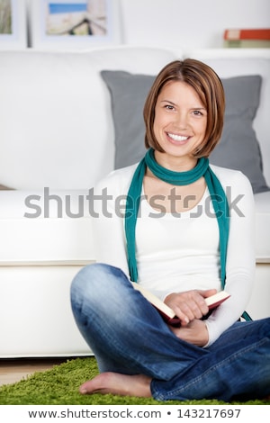 [[stock_photo]]: Young Woman Sat On The Floor In Sitting Room