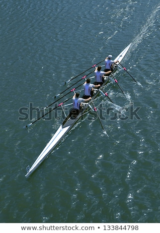 Foto stock: Four Men Rowing