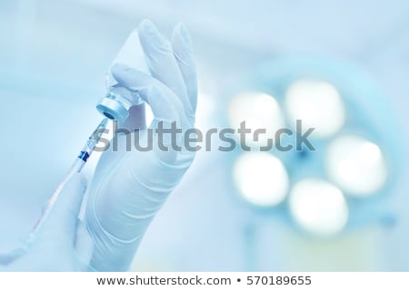 Stock photo: Surgeon Holding Injection Vaccine