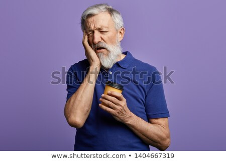 Foto stock: Man Yawning In Cafe