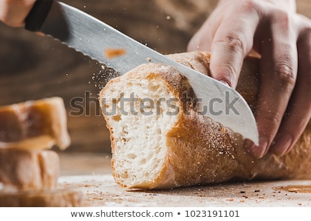 Stock fotó: Fresh Bread Slice And Cutting Knife On Rustic Table