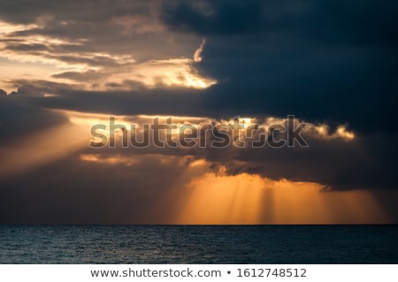 Stok fotoğraf: Sun Rays Shining Through Cloud