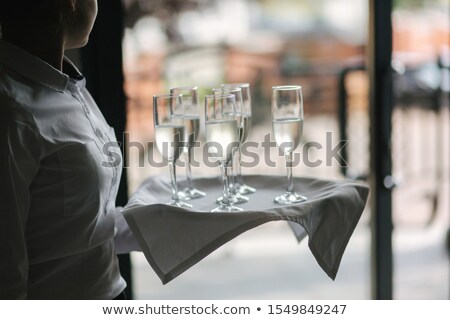 Stockfoto: Hand Holds Tray With Pink Rosechampagne Glasses