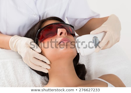 Сток-фото: Beautician Giving Laser Depilation Treatment To Woman Face