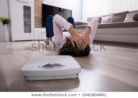 Stock photo: Close Up Of Weighing Scale On Hardwood Floor