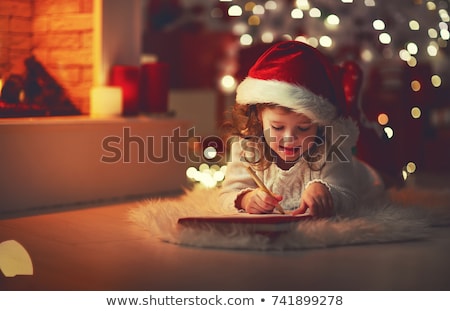 [[stock_photo]]: Little Girl Writing Christmas Wish List At Home