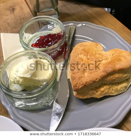 Stock photo: Heart Shaped Scones With Strawberry Jam And A Cup Of Tea