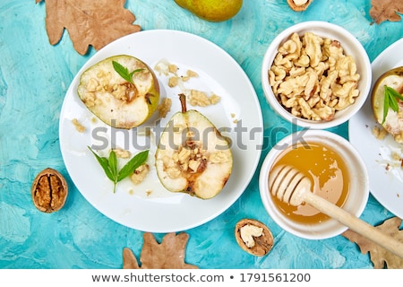 ストックフォト: Tasty Roast Pears With Honey And Walnuts On Blue Background Table