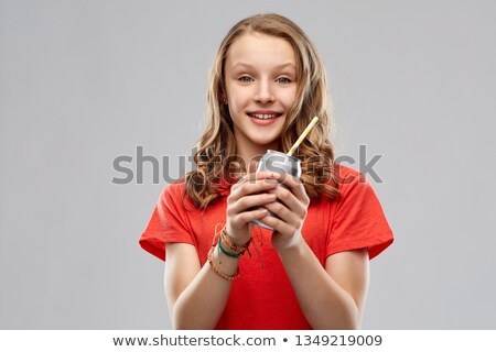 [[stock_photo]]: Teenage Girl Holding Can Of Soda With Paper Straw
