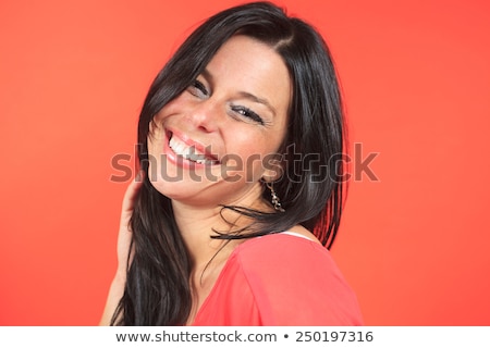 Stockfoto: Portrait Of A 30 Years Old On A Orange Background