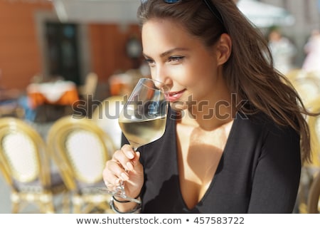 Beautiful Woman Is Drinking Wine In A Restaurant ストックフォト © lithian