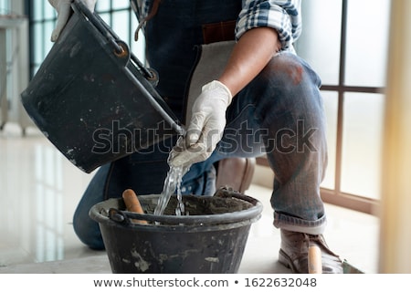 ストックフォト: Man Mixing Plaster