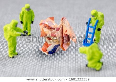 ストックフォト: Miniature People In Action With Euro Banknotes
