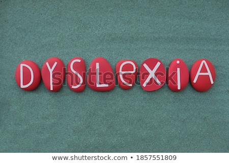 Foto stock: Dyslexia Medical Concept On Red Background