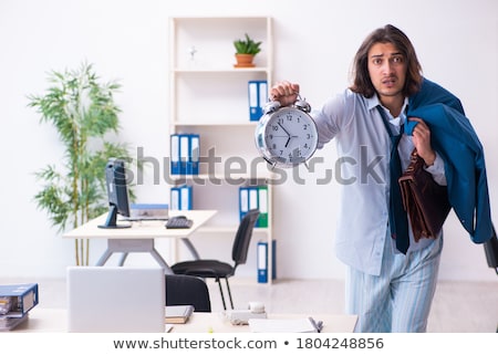 Stock foto: Employee Coming To Work Straight From Bed