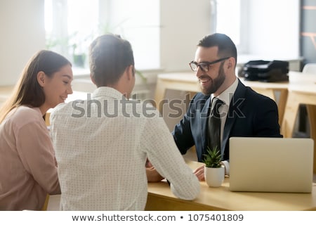 Stock photo: Friendly Lawyer Or Financial Advisor Consulting Young Couple