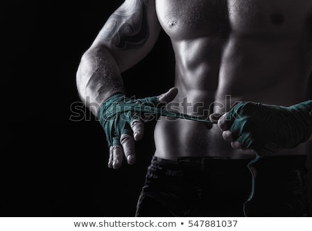 Foto stock: Boxer Putting On Straps Preparing For Combat