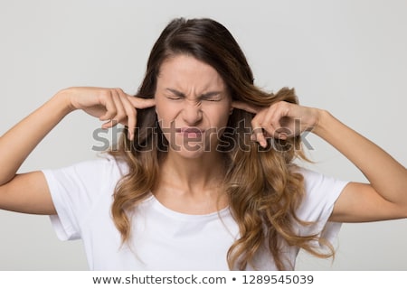 Stockfoto: Teenage Girl With Fingers In Ears