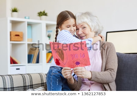 Stock foto: Girl Embracing Her Grandmother