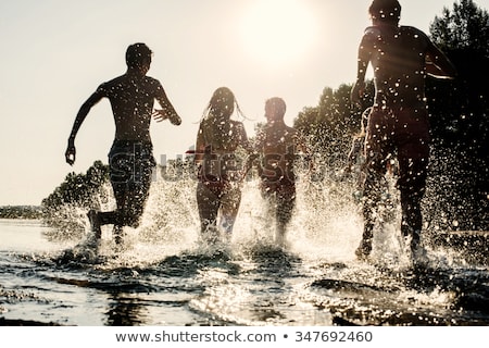 Stock foto: Feet Of Boy Jumping Into The Water