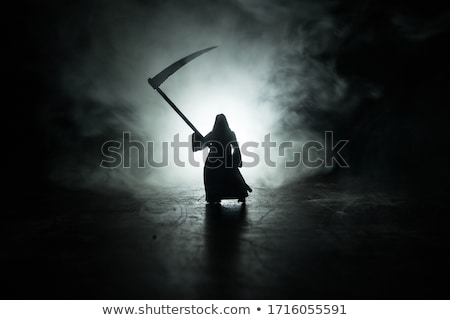 Foto d'archivio: Woman In Halloween Concept With Scythe