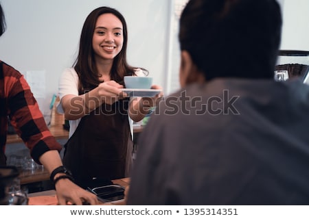 Сток-фото: Female Bartender Serving Drink To Male Customer