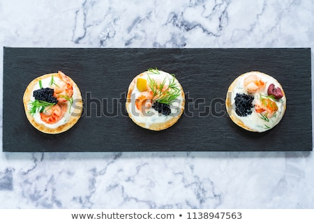 Foto stock: Smoked Salmon Canapes With Sour Cream And Caviar