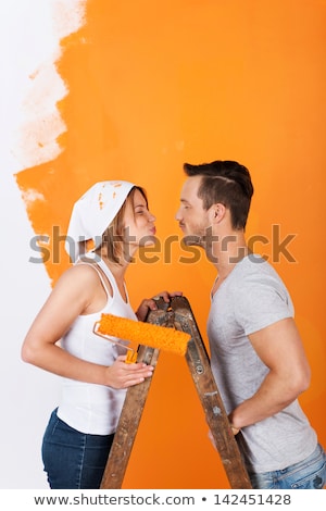 Stok fotoğraf: Couple Kissing While Decorating