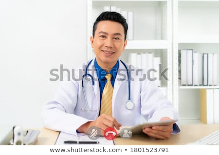 商業照片: Asian Man Doctor Online Consultation Concept