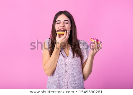 Smiling Red Haired Teenage Girl Eating Donut Zdjęcia stock © Photoroyalty