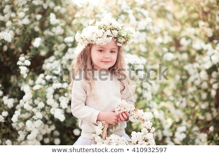 Stok fotoğraf: Smiling Baby 3 4 Year Old Standing With Basket Of Flowers Outdoors Looking At Camera Summer Season