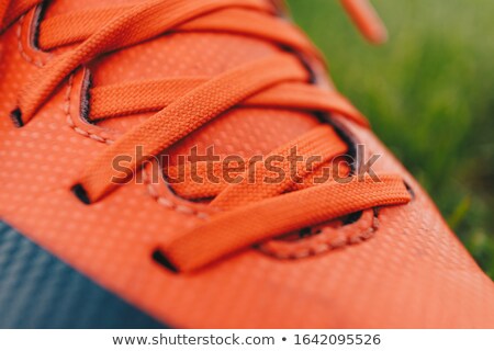 Close Up Of A Soccer Players Cleat On Grass Field Red Sports Stockfoto © matimix