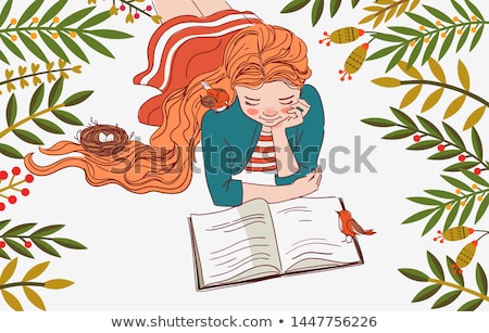 Stockfoto: Cute Young Woman With Curly Hair Lying Reading