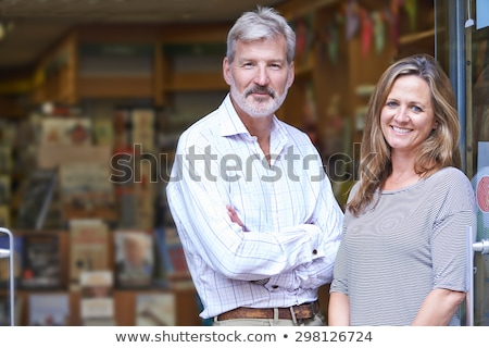 ストックフォト: Portrait Of Couple Who Own Bookshop Outside Store