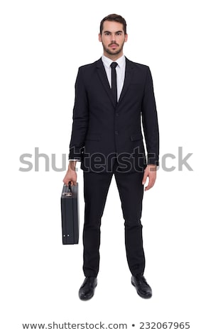 Stock photo: Young Businessman Holding Briefcase Isolated On White