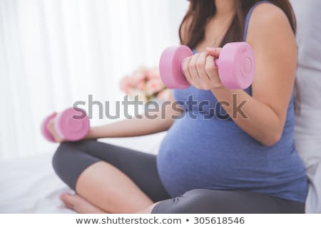 Foto d'archivio: Close Up Portrait Of A Woman Doing Exercises With Barbell