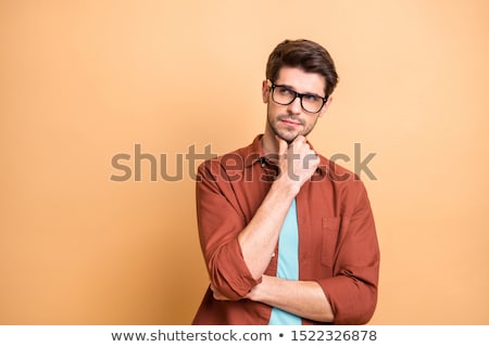 Zdjęcia stock: Serious Young Man Focuses His Mind