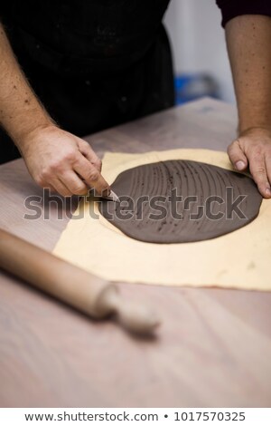 Stock fotó: Skilled Master Preparing Clay Pieces For His New Creations